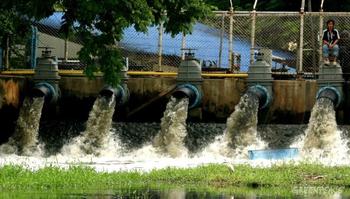 Contaminated waste water pours into a public canal in Thailand from a industrial treatment plant